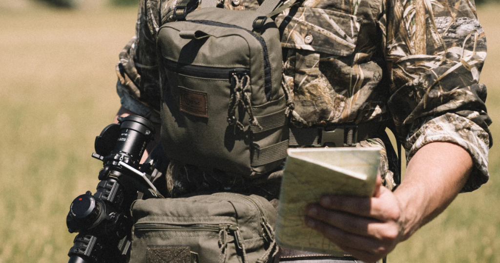 A man out hunting completing his pre-check gear noise list.