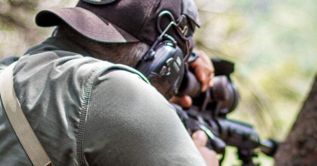 A man at a PRS competition using a Cole-TAC shooting bag.