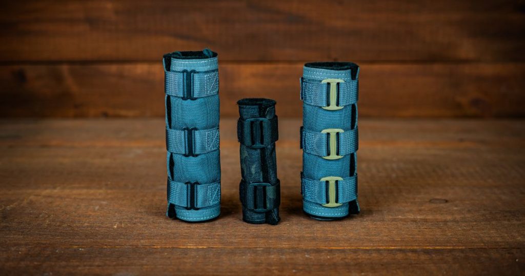 Cole-TAC Python Suppressor series in blue on a wooden table.